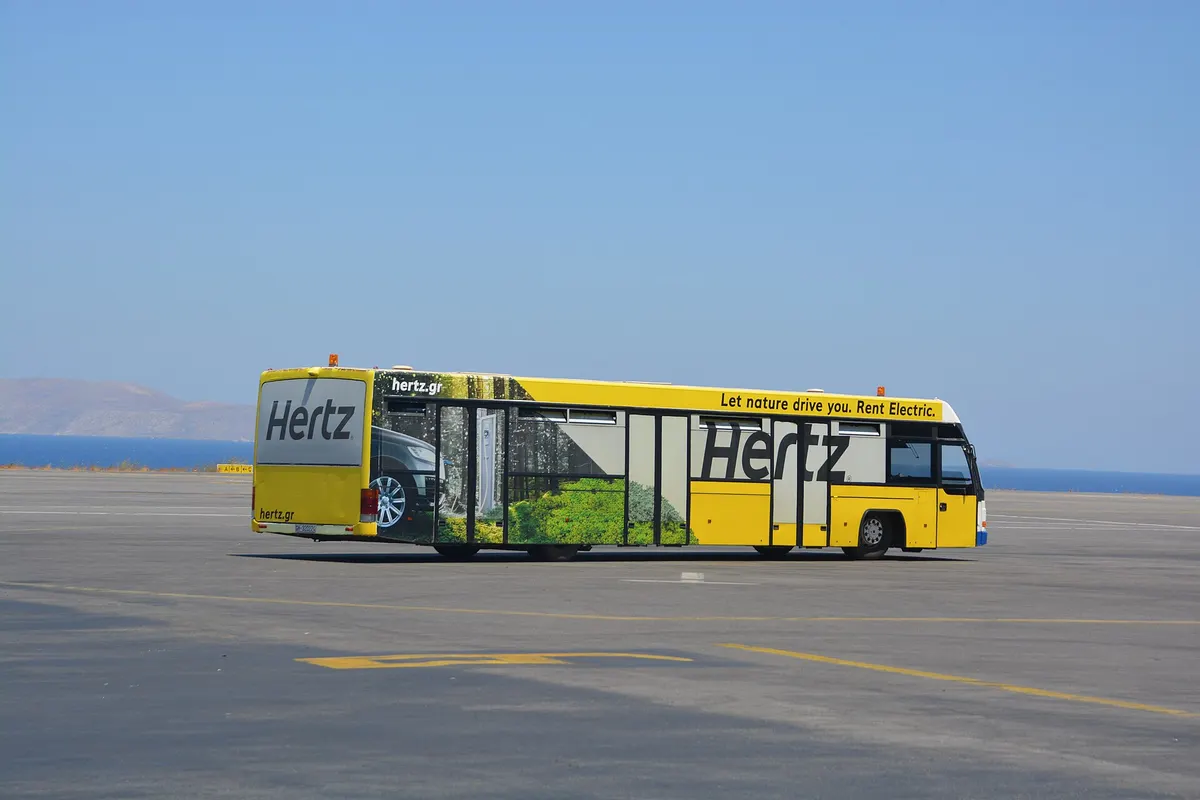 Car rental shuttle bus on the apron at Heraklion Airport