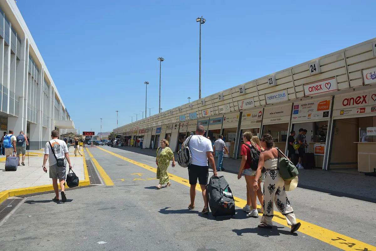 Forecourt of Heraklion Airport where transfer drivers and rental desks wait